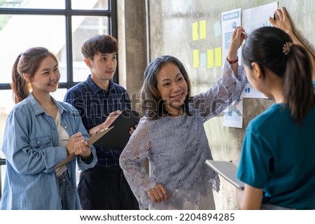 Business meeting concept brainstorming financial analyst financial report on graph document during corporate meeting discussion Demonstrates successful teamwork.
