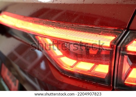 headlight of red car, transportation industry