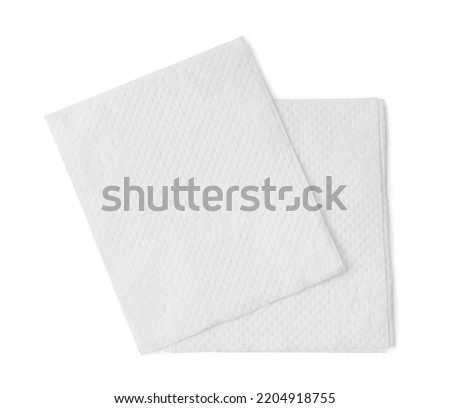 Two folded pieces of white tissue paper or napkin in stack are isolated on white background with clipping path. Royalty-Free Stock Photo #2204918755
