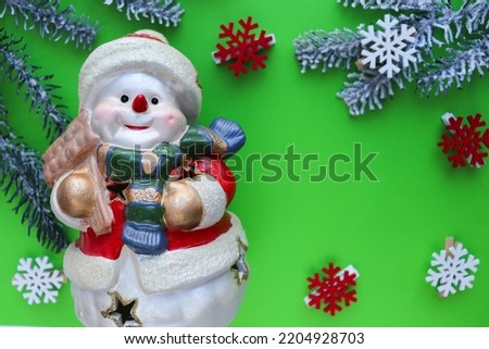 christmas greeting card. snowman, fir branches and white blank for text