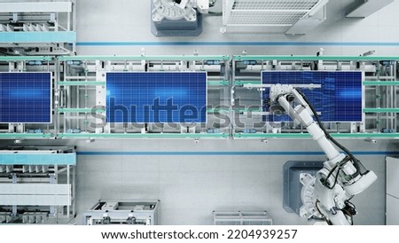 Top View of Solar Panel Assembly Line with Robot Arms at Modern Bright Factory. Solar Panel Production Prodcess at Automated Facility Royalty-Free Stock Photo #2204939257