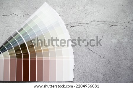 Paint samples earth tone colors swatch for interior design. Abstract and concrete background, copy space.
