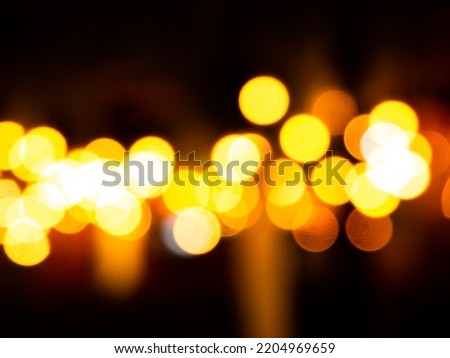 Light Night Bokeh dark Black Background,Abstract Orange Red Colorful Circle Effect Sparkle Blurry Backdrop,for Invitation Special Gala,Birthday Card,Christmas Holidays Celebration,Happy New Year 2023.