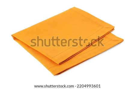New clean orange cloth napkin isolated on white Royalty-Free Stock Photo #2204993601