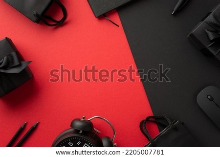 Black friday concept. Top view photo of computer mouse gift boxes with bows alarm clock paper bags notebook and pencils on bicolor red and black background with copyspace in the middle