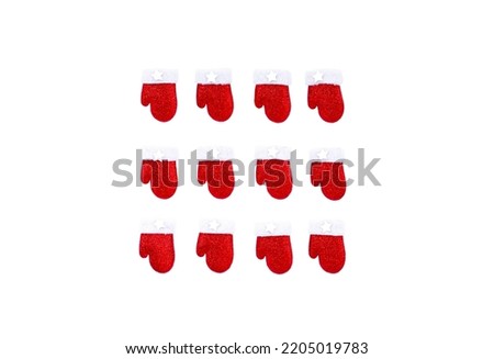twelve insulated santa claus mittens on a white backround