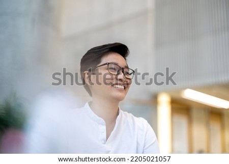 Portrait of a smiling young man in the office
