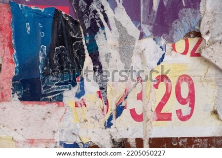 Ripped street poster background with text and numbers, abstract weathered paper collage