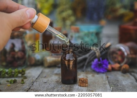 Medicinal herbs and tinctures homeopathy. Selective focus. Nature. Royalty-Free Stock Photo #2205057081