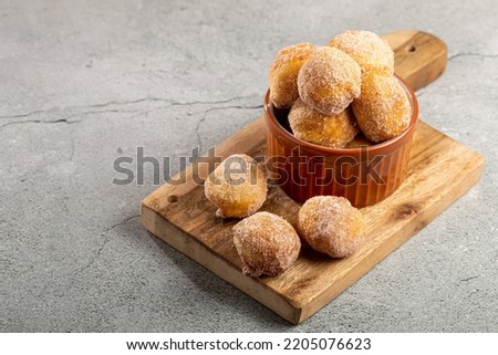 Bowl with rain cookies. In Brazil known as "bolinho de chuva". Royalty-Free Stock Photo #2205076623