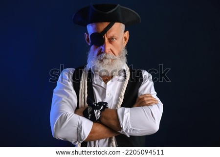 Old pirate with rope on dark background