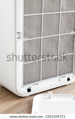 HEPA filter for air purification in the apartment and office is covered with a layer of dust. Purity. ecology. Clean Air