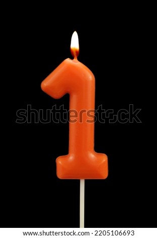 Red birthday candle isolated on black background, number 1 Royalty-Free Stock Photo #2205106693