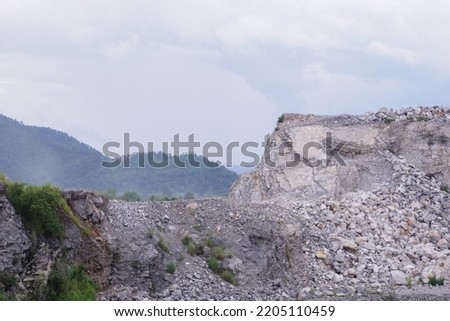 The limestone mountains after the concession explosion during the rainy season form a large and beautiful pond.