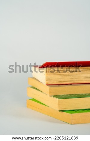stack of colorful books isolated