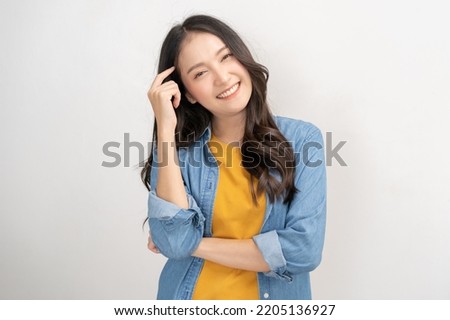 Smiling positive, attractive asian young woman wearing casual dress, cheerful portrait of beautiful brunette her with long hair, feeling happy looking at camera standing isolated on white background.