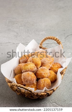 Basket with rain cookies. In Brazil known as "bolinho de chuva". Royalty-Free Stock Photo #2205137159