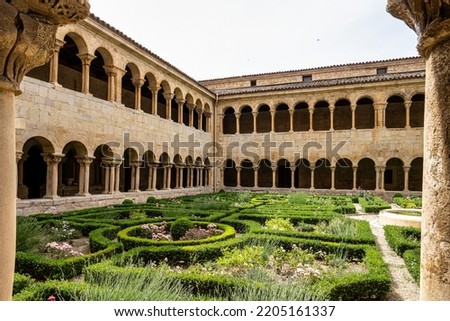 The cloister of Santo Domingo de Silos Abbey at Burgos, Spain. It is a Benedictine monastery and a masterpiece of Romanesque art. Royalty-Free Stock Photo #2205161337