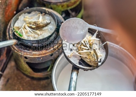 Banh Khoai Ca Kinh or Siganus canaliculatus fish khoai cake, Vietnamese food, from Thua Thien Hue only , Vietnam. At Chuon lagoon near Imperial City with the Purple Forbidden City 