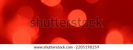 Blurred lights red background, banner texture. Abstract bokeh with soft light header. Wide screen wallpaper. Panoramic web banner