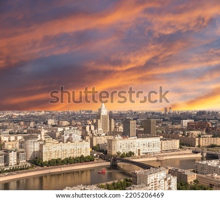 Aerial view of center of Moscow against the background of a romantic evening sky with clouds and rays of the sun (building Ministry of Foreign Affairs), Russia 