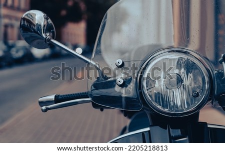 Close up detail of a classic vintage scooter parked in a street Royalty-Free Stock Photo #2205218813