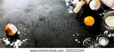 baking background with raw eggs, sugar and flour Royalty-Free Stock Photo #220522264