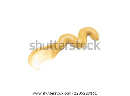 honey mustard sauce pouring in white plate