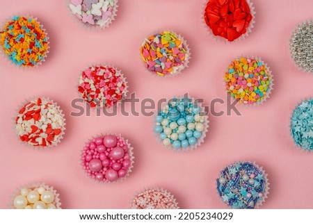 Patter from confectionery decor, the sweetest day. Abstract background. Bright background. Royalty-Free Stock Photo #2205234029