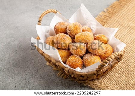 Basket with rain cookies. In Brazil known as "bolinho de chuva". Royalty-Free Stock Photo #2205242297