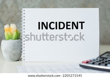 INCIDENT inscription on a notebook on a table, a business concept