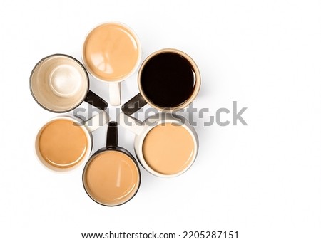 multiple cups of coffee placed in flower shape on white background, morning and wake up concept, space for text or promo.