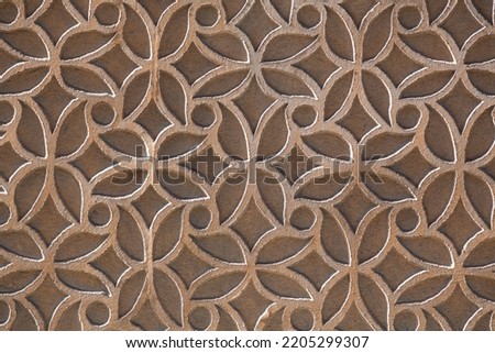 Fragment texture background from a stucco wall covered with traditional patterns in Segovia, Spain.