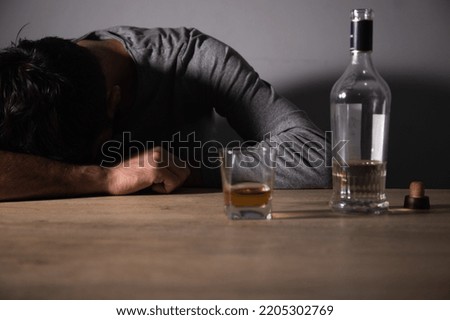 The drunken man fell asleep. Alcoholism concept Royalty-Free Stock Photo #2205302769