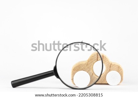 toy car and magnifying glass