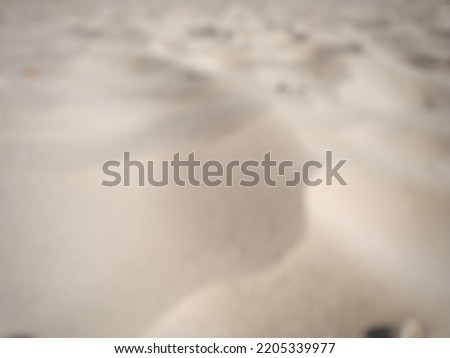 defocused abstract background of sand filled frame.