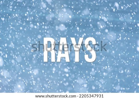 RAYS - word on the background of the sky with clouds.