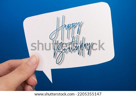 Speech bubble in front of colored background with Happy Birthday text.