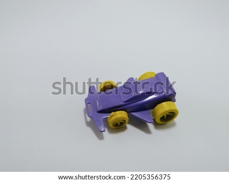toy car, purple color vehicle on white background.