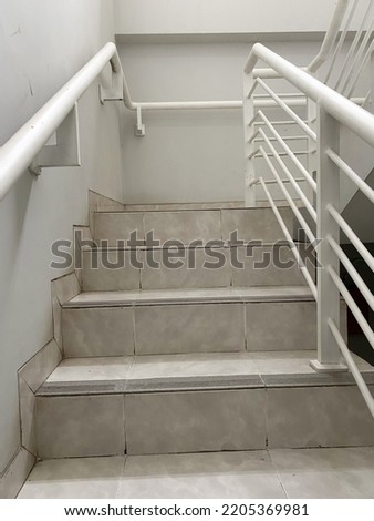 staircase with metal handrails in modern home interior