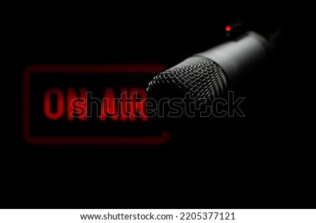 Professional microphone and on air sign Royalty-Free Stock Photo #2205377121