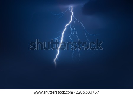 Thunder cloud lightning dark cloudy sky. One stormy day, lightning struck the sky.
