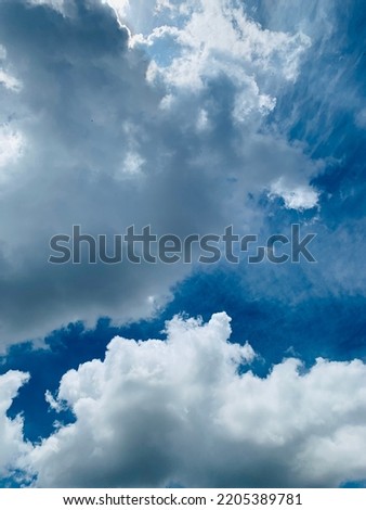 white cumulus clouds layered Covering the beautiful sky in Bangkok, Thailand. no focus