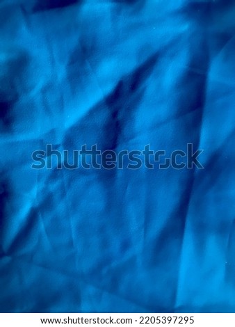 The color of the wall cloth is bright navy blue as shown in the picture