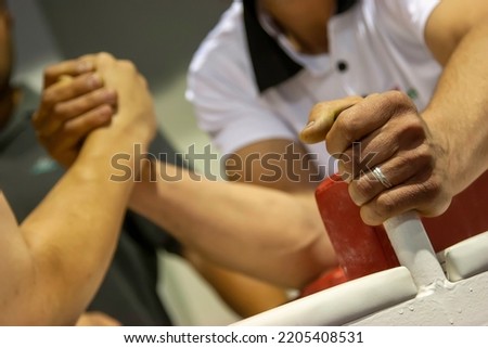 Two men in arm wrestling competition 
