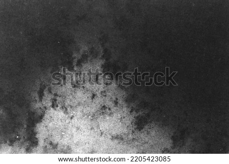 black and white texture of old paper with water stains as a background. grunge texture for design