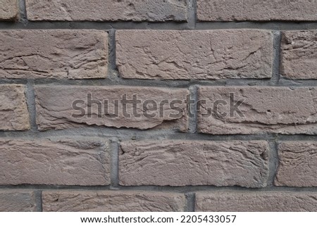 Macro of dark chocolate brown brick wall