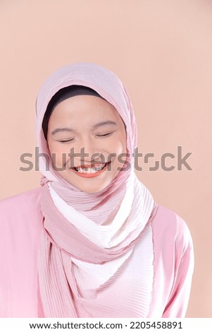 Beautiful Asian women in hijab over isolated background. Casual outfit to office and daily use.