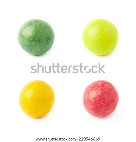 Four single chewing gum balls, close-up composition isolated over the white background, set of four color versions