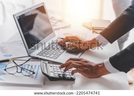 Young colleagues having great business conversations in a modern coworking office. Teamwork concept. Horizontal blurry background. Fireworks. Royalty-Free Stock Photo #2205474741